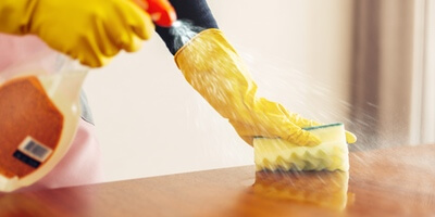 dusting and polishing furniture